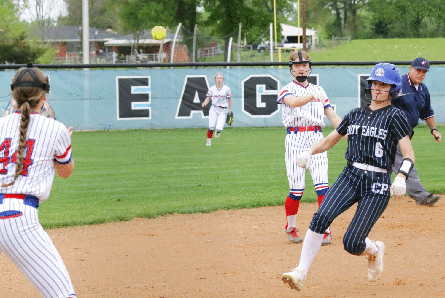 Lady Panther shortstop Cacie Lennon throws to teammate Skyler West at third in an effort to get the advancing Lady Eagle runner. It was a close play with the runner safely beating the tag.